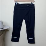 Athleta  • relay capri legging with reflective detail Photo 67