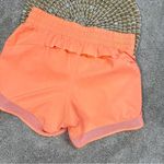 Athleta Mesh Racer Run Mid Rise 4” Shorts Pull On Running in Orange Size XXS Photo 6