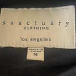Sanctuary jacket, size medium. It zips up front with an oversized snap closure. Photo 5