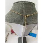 Boutique Gold tone rhinestone cross necklace Photo 3