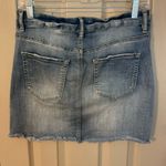 Indigo Rein  medium/light was distressed button front denim mini skirt. Photo 7