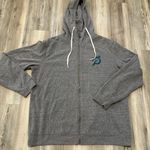 Peloton Gender neutral, full zip sweatshirt with an exaggerated hood, front hand pockets, and rib detail  at sleeve cuffs and bottom band Garment dyed for a worn in feel 100% cotton  logo at left chest  Studios logo at center back Made in the USA No size tag pit to pit measurement is 26,length is 30 Photo 0