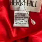 Sherri Hill short red dress with cutouts and a sheer neckline Photo 9
