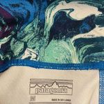 Patagonia Women’s blue/white/teal paint splash pattern leggings Medium Photo 3