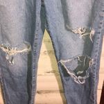 Forever 21 distressed washed jeans size 31 trendy holy jeans tapered bottoms Photo 1
