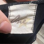 One star shiny black sleeveless blouse Photo 3