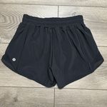 Lululemon  Hotty Hot Short 4" Black  Running Shorts OVA‎ Logo Size 4 Tall Photo 1