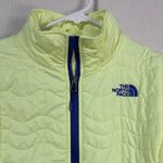 The North Face  Women's Quilted Puffer Jacket - Pale Yellow with Blue Trim Photo 1