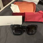 Gucci GG1714S cat-eye sunglasses with a black frame and solid grey lenses Photo 5