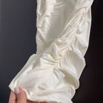 Women size S small One shoulder ivory top with black bow and crystals Photo 4