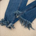 Free People  skinny jeans with rip and fringe Photo 1