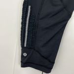 Lululemon Size 8 Black, Purple Crop Ruffle Ankle Trim Leggings with Zip Pocket Photo 6