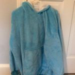 This is a blue snuggie from blankets and hoodies! Size undefined Photo 0