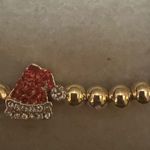 BaubleBar  womens gold Santa hat stacking bracelet Photo 2