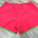 Adidas Women's Vibrant Red Athletic Shorts with Green Trim are a size Large. Photo 11