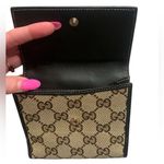 Gucci •  gold heart canvas and leather bifold wallet Photo 3