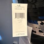 “Strapless dress with an abstract print in shades of blue, purple, and black. Blue Size 4 Photo 3