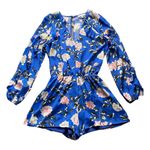 Karina Grimaldi Stunning bright blue floral romper, long sleeve with ruffle front of romper is lined and the bottoms are lined, elastic waistband, 70% silk and 30% viscose, perfect condition, size large Measurements: Bust: armpit to armpit 21 inches  Waist: side to side 14-17 inches  Length: shoulder seam to bottom 32 inches Photo 1