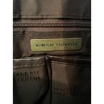 Valerie Stevens  leather crossbody bag in brown. Photo 1