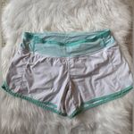 Lululemon Size 6 Turbo Running Short in white with a mint green waistband Photo 2