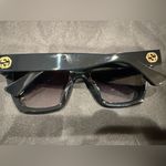 Gucci GG1714S cat-eye sunglasses with a black frame and solid grey lenses Photo 7