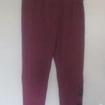 PINK - Victoria's Secret  sweatpants with pink pink on left bottom leg in burgundy red and black in small. Photo 0