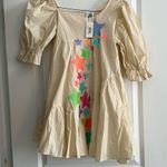 Queen of Sparkles. NWT size XS tan star dress. Photo 0
