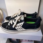 Cariuma Black Canvas Sneakers‎ with White Stripe Detail & Green Inner Sole Photo 2