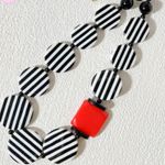 Striped Black and White Necklace with Red Accent Photo 0