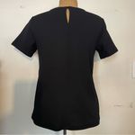 Ann Taylor black short sleeve top ruffles on front size small Photo 2