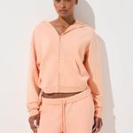 SKIMS French Terry Zip Up Hoodie in Cantaloupe, Size Small Photo 0