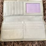 Coach  Silver/Gray and tan signature Turnlock wallet with purple lining Photo 2