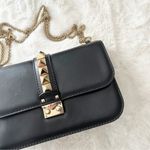 Valentino Garavani Valentino Rockstud Medium Glam Lock Flap Bag in Black Photo 1