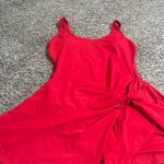 Blooming Stylish red sleeveless dress featuring a chic side knot. Perfect for any occasion. Photo 4