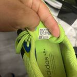 Adidas Neon Green Athletic Shoes with Black Stripes Photo 4