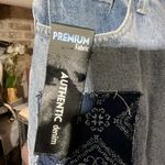 Simple Society PREMIUM Fabric AUTHENTIC denim patches jeans pants 9/29 NWT New with tag  Same day shipping  Smoke and pets free  Elevate your denim game with these premium  jeans. Crafted with authentic denim and stylish patches, these straight leg jeans feature a comfortable zip and button closure, as well as practical pockets. The distressed details and cropped length add a trendy touch to this classic wardrobe staple.   Perfect for any casual occasion, these jeans are a must-have for any fashion-forward woman. Available in size 29 and with tags still attached, these jeans are brand new and ready to be added to your collection. Get your hands on these  premium denim jeans today! Photo 1
