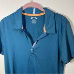 Oakley ✨  Women’s Teal Polo Shirt Medium Photo 1