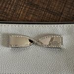 Victoria's Secret Victoria’s Secret silver metallic cosmetic bag with bow accent New Photo 1