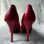 Qupid Vibrant red high heel shoes with an elegant and daring design. Photo 1