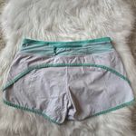 Lululemon Size 6 Turbo Running Short in white with a mint green waistband Photo 3