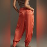 Anthropologie coral satin joggers Photo 2