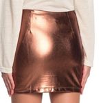 Line and Dot Gold Mini Pencil Skirt with Ruffled Detail Photo 1