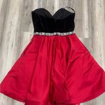Ashley Lauren Black and Red Strapless Dress with Embellished Waist Photo 1