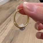 Gold Oval Dangle Diamond Encrusted Earrings Photo 1