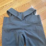 Athleta Salutation Stash Wrap Tight leggings cutouts pockets Hematite Grey Sz LP Photo 6