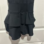 Edara NWT  The Signature Ruffle Dress Size Small . This one does not come with the sport bra as seen on the stock picture.   The criss-cross back of the Ruffle Dress gives non-restrictive mobility and is effortless to pull on and take off. A wide waistband anchors the relaxed fit of the bodice, which drapes loosely to create a flattering and comfortable midsection for diverse body types. Pair this dress with an Advantage Sports Bra and coordinating Ace Visor for a complete, finished look. Photo 5