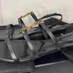Saint Laurent CASSANDRA LEATHER WITH GOLD EMBLEM HARDWARE IN BLACK SANDALS. Photo 0