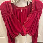 Free People Movement FP Dakota Long sleeve in the color Pomegranate (Reddish/magenta)  top with an elastic band around the bottom #freepeople #fpmovement Photo 3