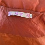 Boutique Rust Orange Puffer Photo 15