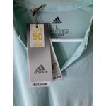 Adidas NWT  Golf Women's Polo Shirt UPF 50 in Light Blue Size L Photo 1